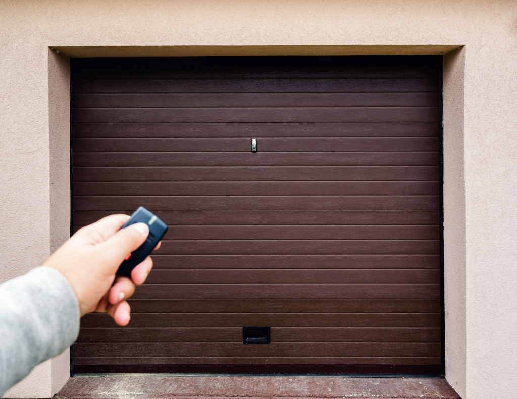 universal garage door opener remote in front of a brown garage door